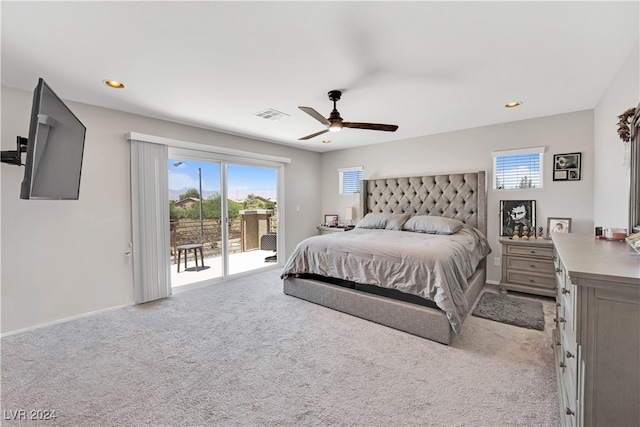 carpeted bedroom featuring ceiling fan and access to outside