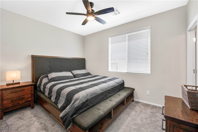 bedroom with ceiling fan and light carpet