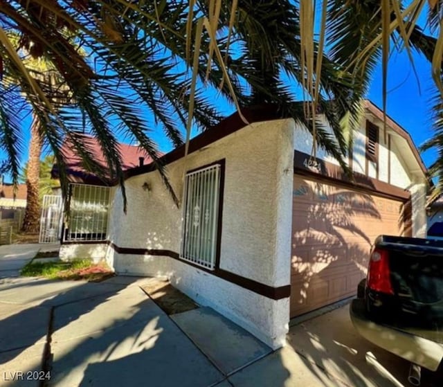 view of property exterior featuring a garage