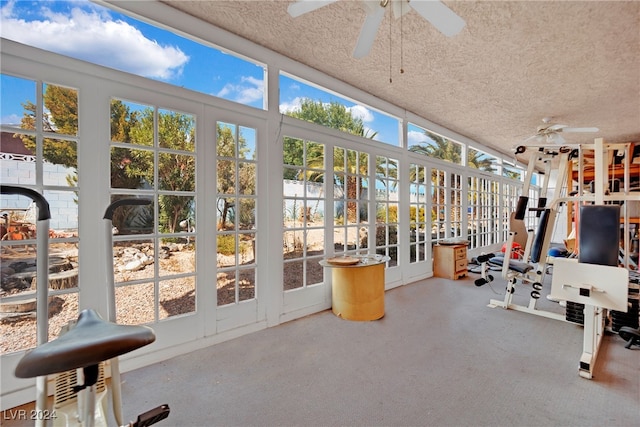 sunroom featuring ceiling fan