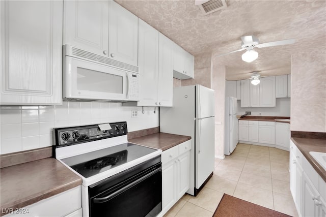 kitchen with ceiling fan, white cabinetry, light tile patterned floors, backsplash, and white appliances