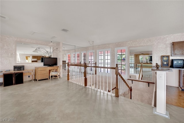 corridor featuring light tile patterned flooring