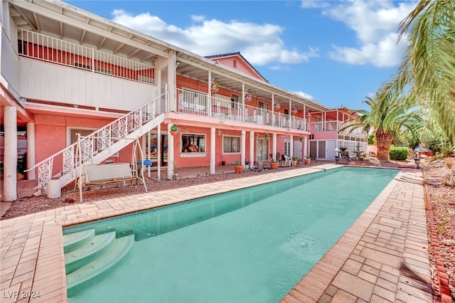 view of pool featuring a patio