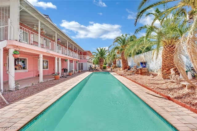 view of pool featuring a patio