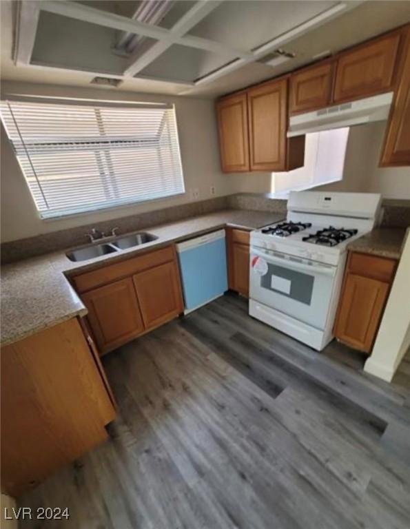 kitchen with dark hardwood / wood-style floors, white range with gas stovetop, sink, and dishwasher