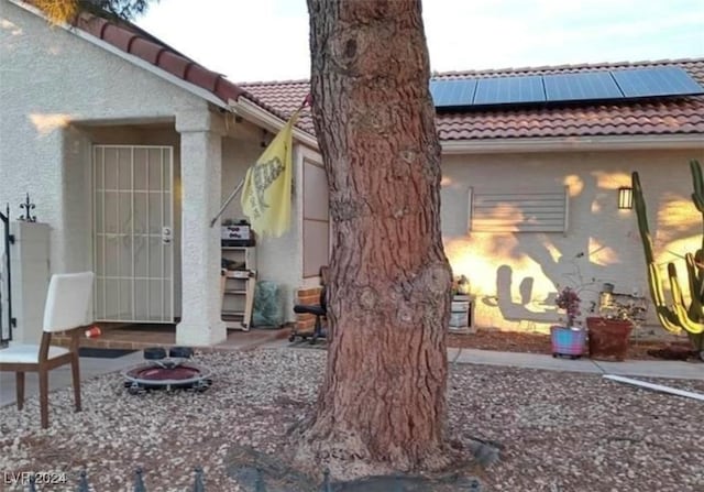 back of property with solar panels