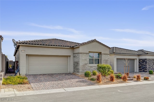 view of front of property with a garage