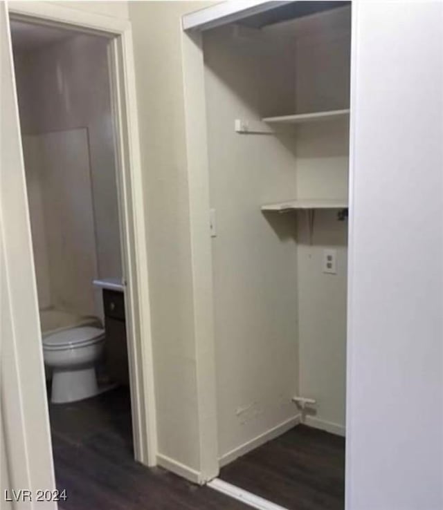 laundry room with dark hardwood / wood-style flooring