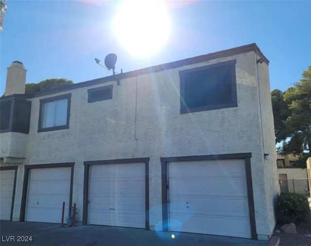 exterior space with a garage