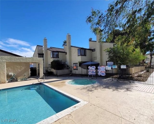 view of swimming pool featuring a patio