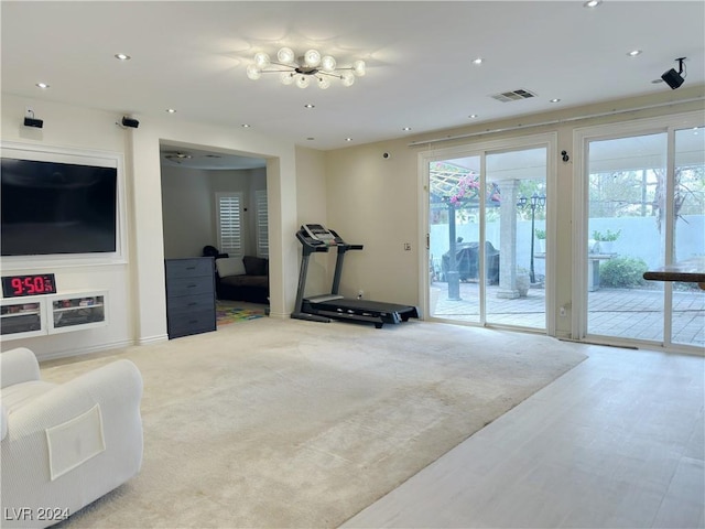 workout room featuring carpet floors, visible vents, and recessed lighting