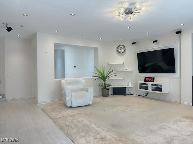 living area with baseboards and recessed lighting