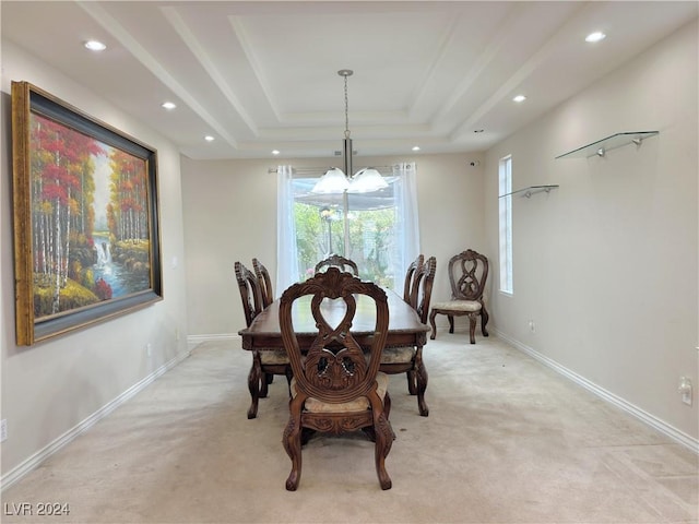 dining space featuring light carpet, baseboards, a tray ceiling, and recessed lighting