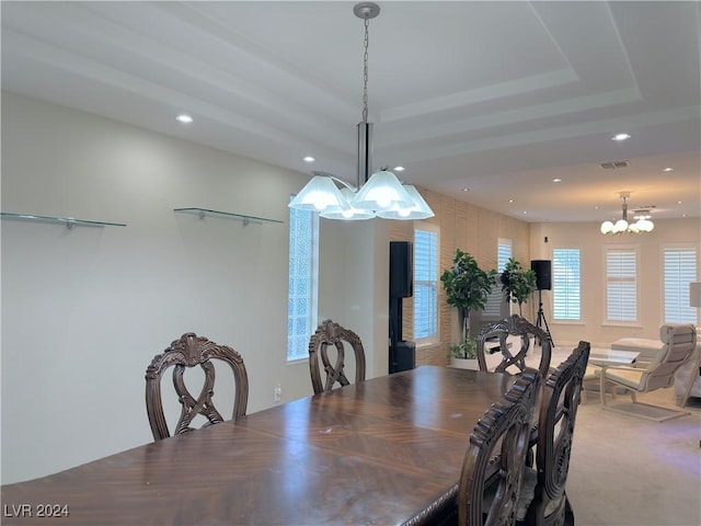 dining area with a chandelier, recessed lighting, a raised ceiling, and visible vents