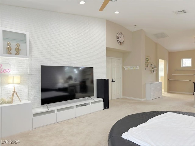 carpeted bedroom featuring lofted ceiling, visible vents, a ceiling fan, and recessed lighting