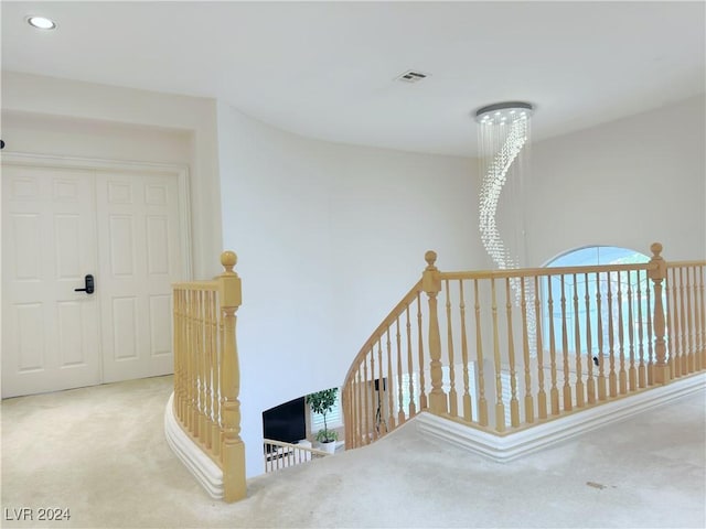 stairway with carpet flooring, visible vents, and recessed lighting