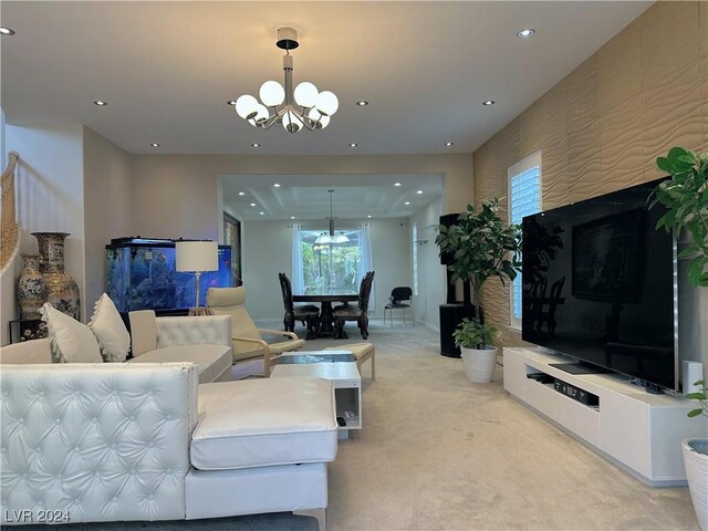 living area with a notable chandelier, recessed lighting, and light colored carpet