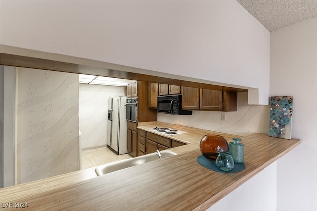 kitchen with white appliances and sink