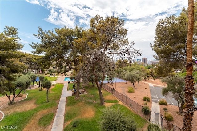 view of community featuring a yard and a pool