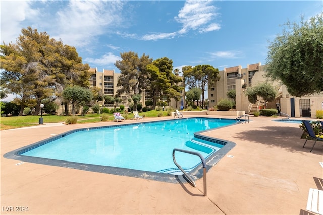 view of swimming pool featuring a patio area