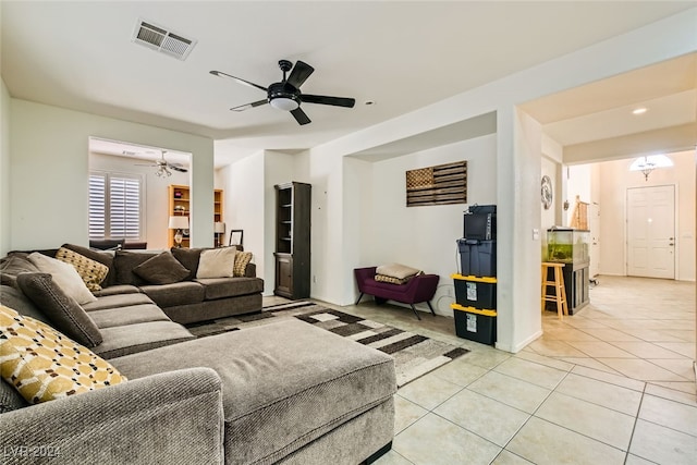 tiled living room with ceiling fan