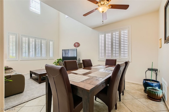 dining area featuring ceiling fan, light tile patterned floors, and plenty of natural light