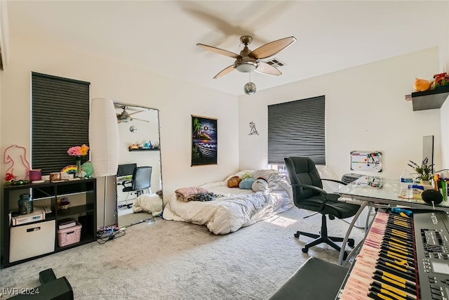 bedroom with ceiling fan and carpet floors