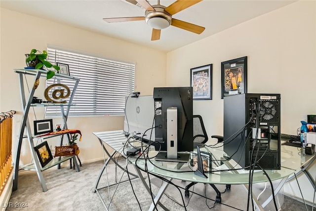 carpeted office space with a healthy amount of sunlight and ceiling fan