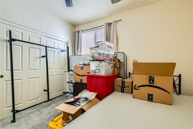 carpeted bedroom with a closet and ceiling fan