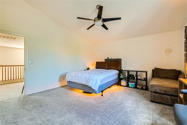 carpeted bedroom featuring lofted ceiling and ceiling fan