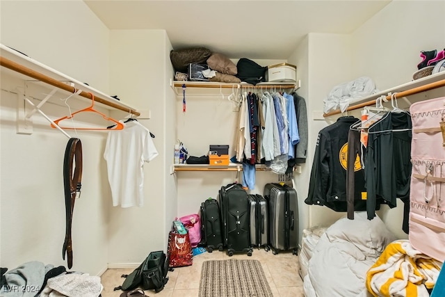 spacious closet featuring light tile patterned flooring