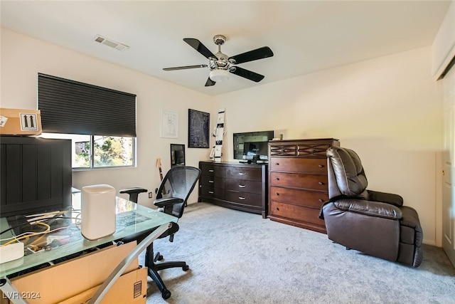 carpeted office with ceiling fan