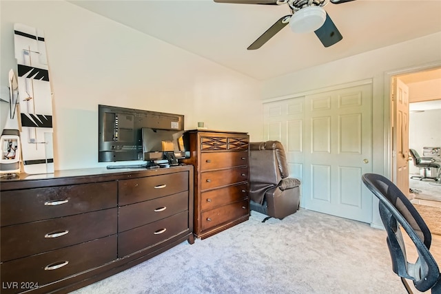 office space featuring light carpet and ceiling fan