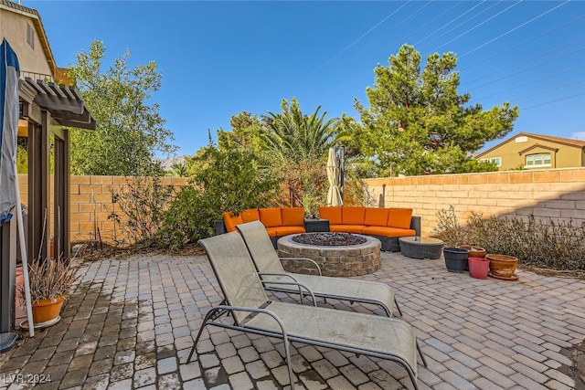 view of patio / terrace featuring an outdoor fire pit