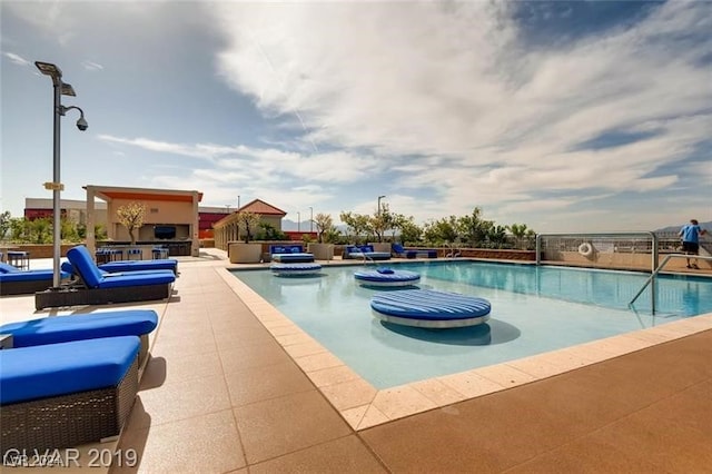 pool with a patio area