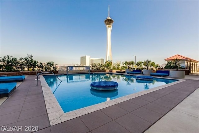 pool with a patio