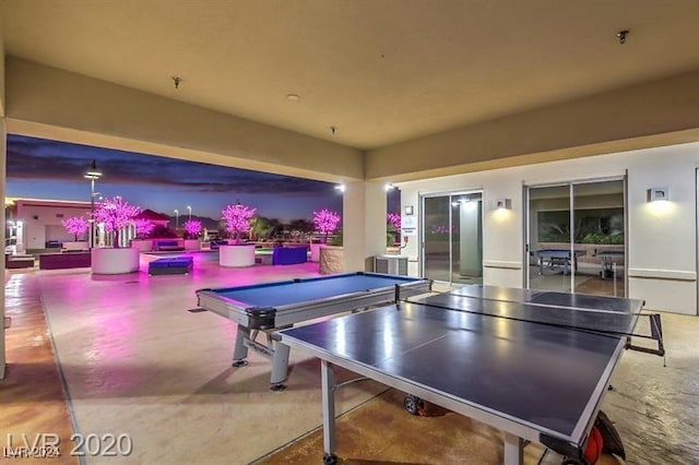 recreation room featuring concrete flooring