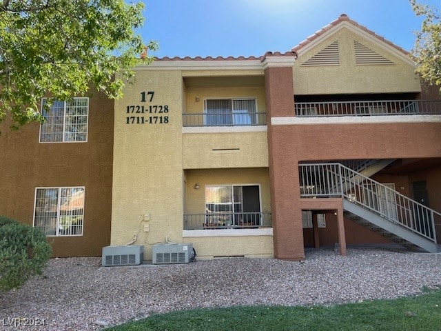 view of building exterior with cooling unit