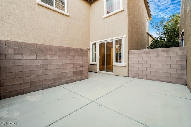 view of patio featuring fence