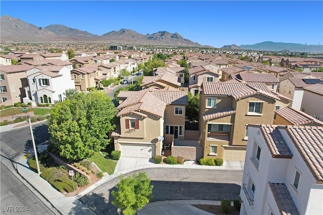 drone / aerial view with a residential view and a mountain view