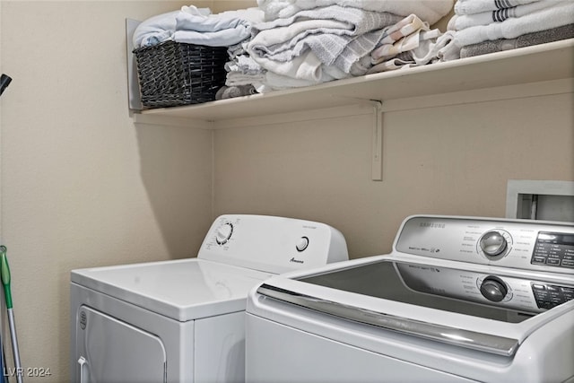 laundry area with washing machine and dryer