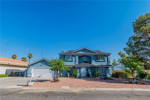 front of property with a garage