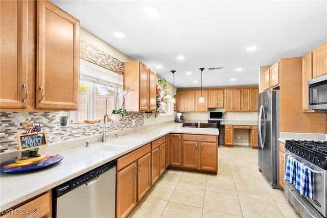 kitchen with light tile patterned floors, appliances with stainless steel finishes, sink, tasteful backsplash, and decorative light fixtures