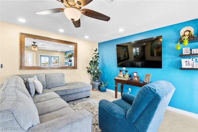 living room with ceiling fan and light tile patterned floors