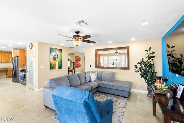 tiled living room with ceiling fan