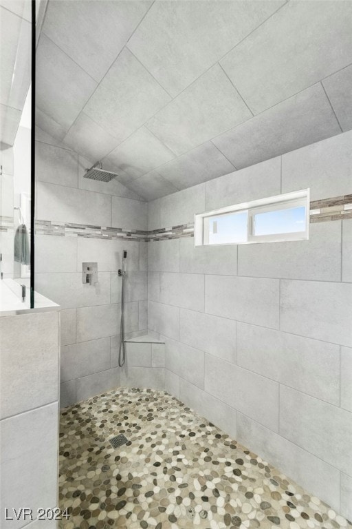 bathroom with a tile shower