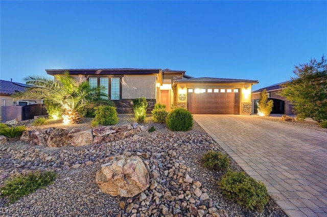 prairie-style house featuring a garage