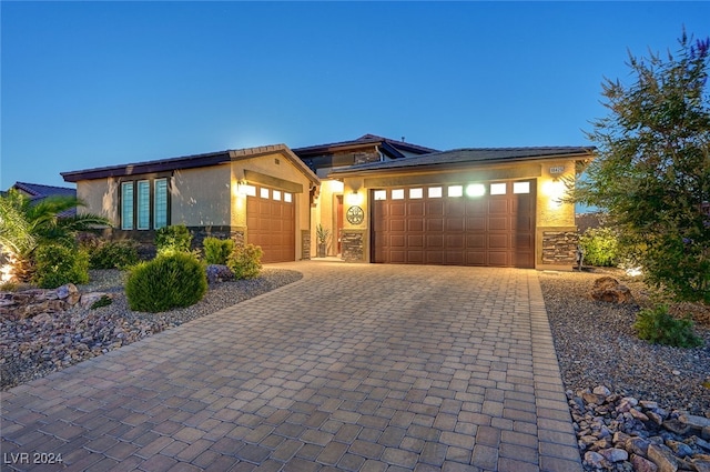 prairie-style home featuring a garage