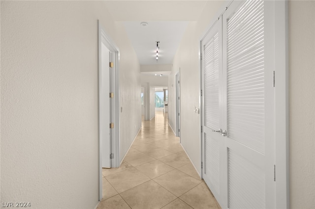 hallway with light tile patterned floors