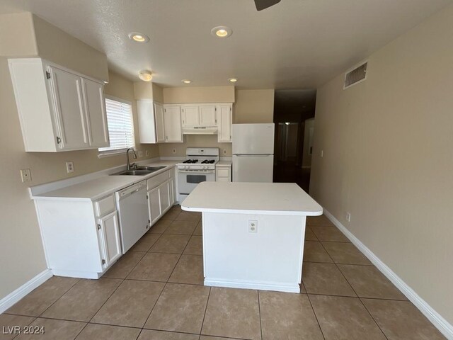 kitchen with white appliances, white cabinets, sink, and tile patterned flooring